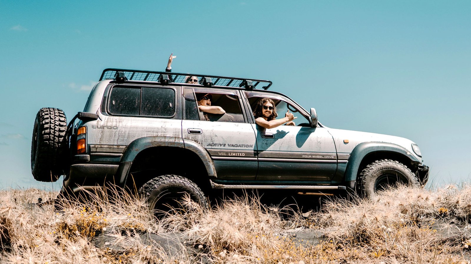 Travellers in a Land Cruiser 4x4 on open country